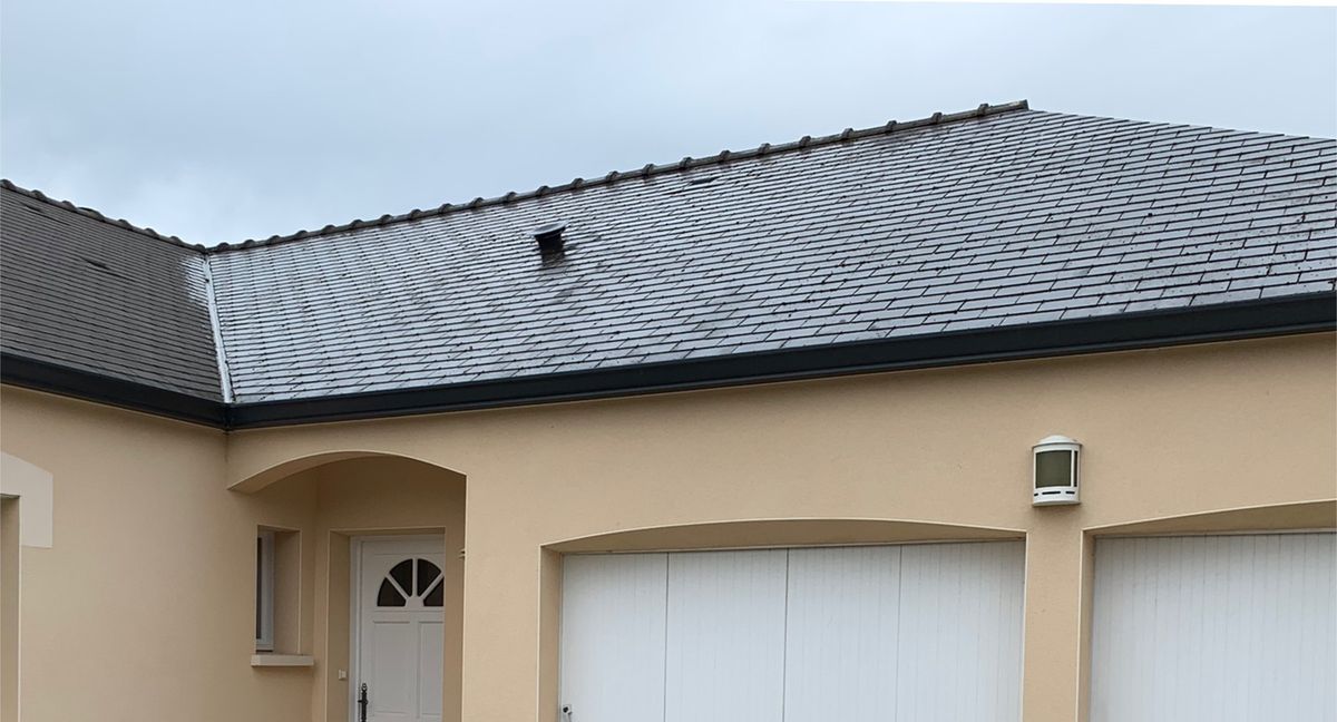 La même maison après pose d'une couverture neuve